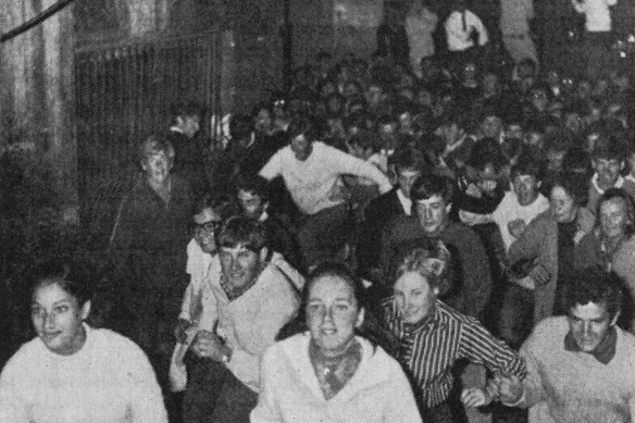  Students and parents race towards the Collins Street Age building to get their copies of the paper with matriculation exam results in 1969.