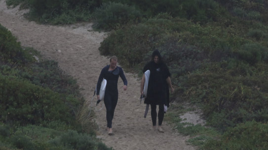 Dockers captain Nat Fyfe. right, spotted going for a surf on Thursday.
