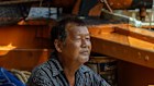 Wittaya Lekdee, a veteran fisherman in Samut Sakhon, Thailand, has not been able to take out his shrimp boat because of high fuel prices. 