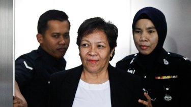 Australian Maria Elvira Pinto Exposto, centre, is escorted during a court hearing in Shah Alam, Malaysia last year.