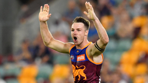 Ex-Cat gets the cream: Lincoln McCarthy celebrates a goal on debut for the Lions at the Gabba.