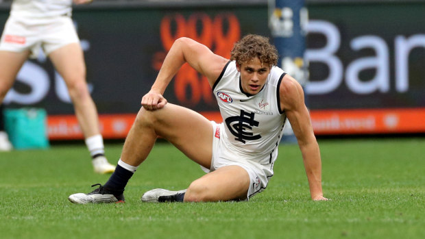 Stricken: Charlie Curnow of the Blues reacts after being injured at Optus Stadium.