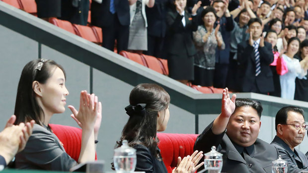 Leader Kim Jong-un, second right, waves with his wife Ri Sol Ju, centre, during an event in Pyongyang, while sister, Kim Yo-jong, on left, looks on.