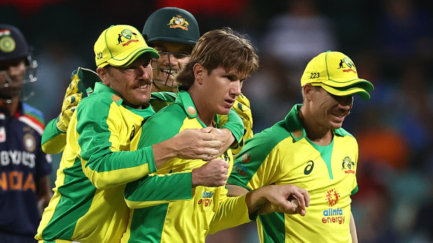 Aaron Finch congratulates Adam Zampa after the spinner dismissed Shikhar Dhawan.