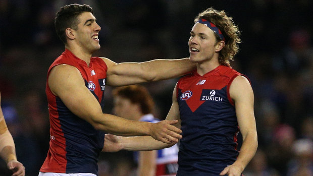 Fall-back forwards: Jayden Hunt of the Demons (right) celebrates a goal with teammate Christian Petracca.