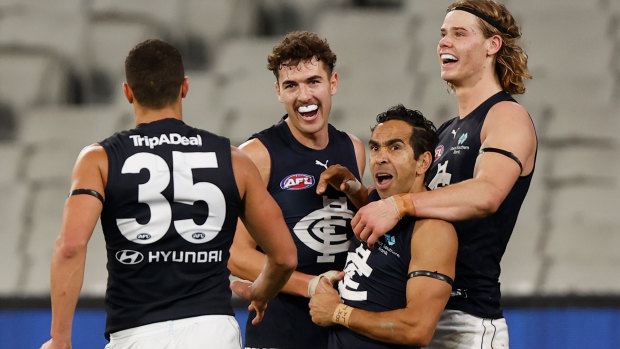 Players celebrate Eddie Betts’ final term goal. 