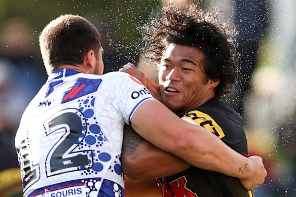 Brian To’o is tackled by Matt Doorey during his shift of chalking up 266 running metres.