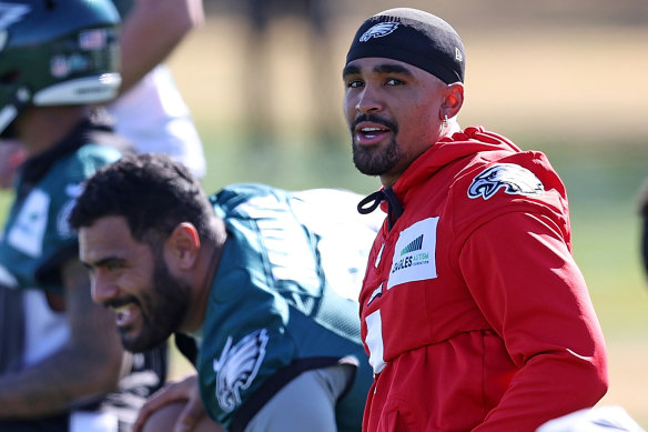 Philadelphia Eagles quarterback Jalen Hurts, right, warms up for February’s Super Bowl with Australian left tackle Jordan Mailata.