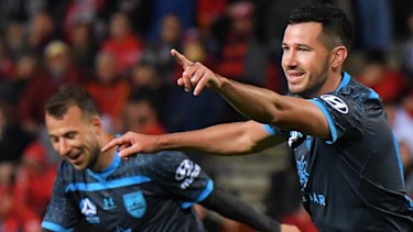 Ryan McGowan (right) celebrates a Sydney FC goal earlier this month. 