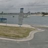 A man was pulled unconscious from the water off Muriel Henchman Drive at the Gold Coast.