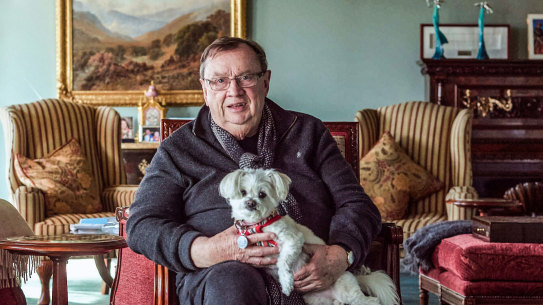 Harold Mitchell in his Melbourne apartment with his dog Lily. 