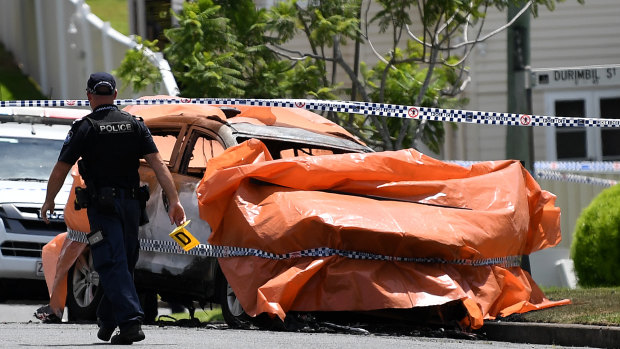 Police at the scene of the horrific incident in Raven Street, Camp Hill.