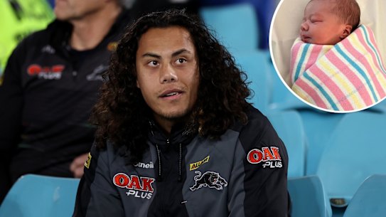 SYDNEY, AUSTRALIA - AUGUST 18: Injured Jarome Luai of the Panthers looks on from the sideline during the round 23 NRL match between the South Sydney Rabbitohs and the Penrith Panthers at Accor Stadium, on August 18, 2022, in Sydney, Australia. (Photo by Cameron Spencer/Getty Images)footy COmposite with image of new child Halo - jaromeluai_ Instagram