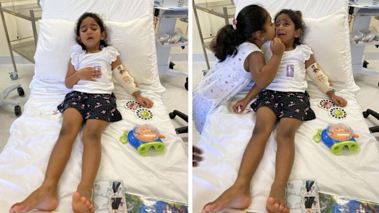 Tharnicaa and her sister Kopika in hospital on Christmas Island on Sunday, June 6.