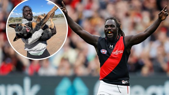 Anthony McDonald-Tipungwuti returned to the AFL on Sunday after retiring to travel (inset) last year.
