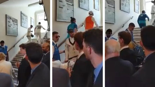 Usman Khawaja spoke with security as he climbed the stairs.