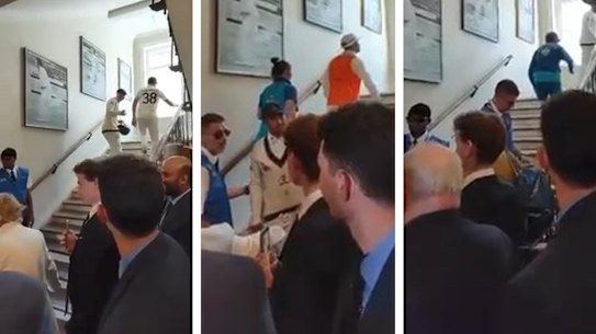 Usman Khawaja spoke with security as he climbed the stairs.