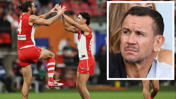 The high-flying Swans and (inset) Matthew Johns.