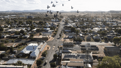 A town gripped by feuds, drugs and a paralysing fear that an accused killer could soon return