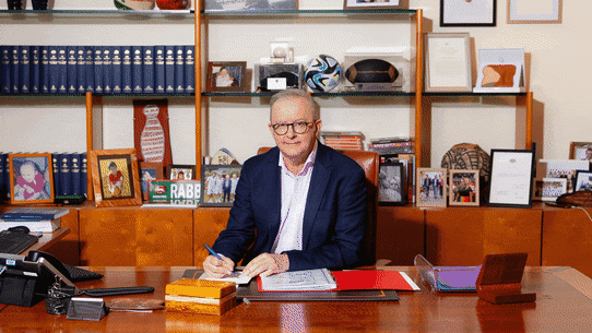 Anthony Albanese, Scott Morrison, Tony Abbott and Julia Gillard at the prime minister’s desk in Parliament House.
