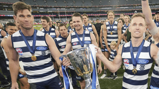Geelong celebrate their 2022 premiership win and the Brisbane Lions theirs in 2024.