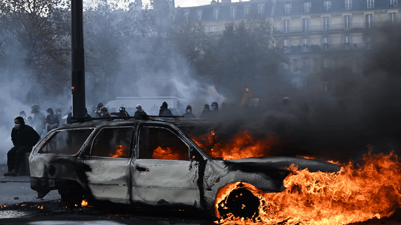 Police clash with protesters in France as tens of thousands rally over cost of living