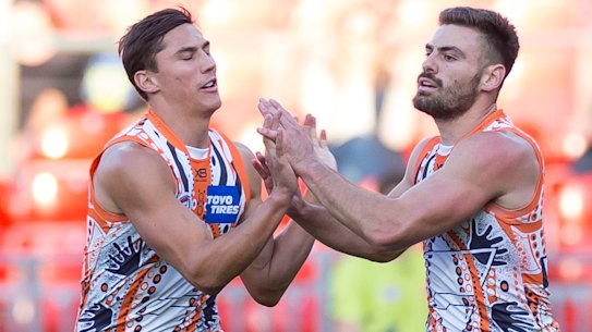 Virtuoso: Stephen Coniglio, right, adds to his tally against the Suns