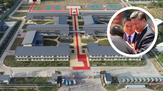 A photo of Xi Jinping greets students at the entrance to the $28 million school.