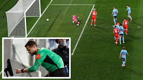 Melbourne City's Harrison Delbridge shoots past Andrew Redmayne. It was ruled Lachlan Wales, centre, was in an offside position and was obstructing the view of Redmayne.