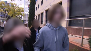 The teenager leaving Perth Children’s Court with his family in July.