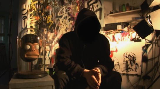 Banksy, or someone claiming to be him, in a scene from the documentary Exit Through the Gift Shop. 