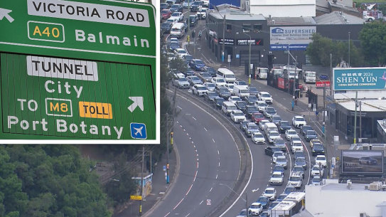 Chaos on Victoria Road and, inset, a confusing sign that will be changed.
