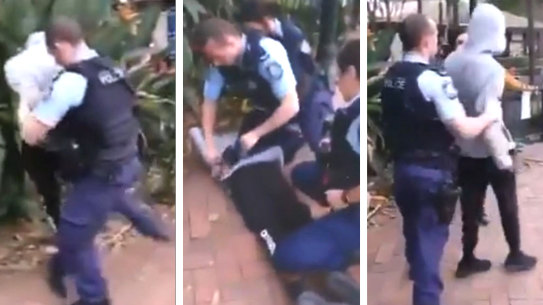 Video still composite story on NSW Police officer handcuff an Aboriginal teenager in Surry Hills.