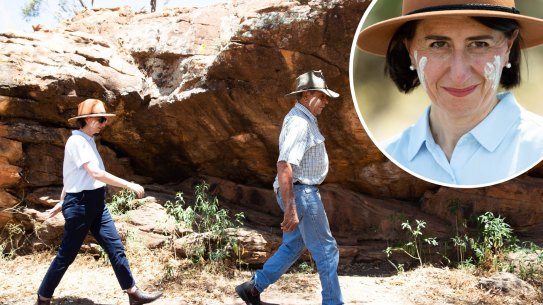 Composite - Uncle Peter Harris and NSW Premier Gladys Berejiklian, walk through the Mount Grenfell Historic Site after the ceremonial signing of over 15,000 hectares to the National Park estate, creating Mount Grenfell National Park and State Conservation area, and the handback of management to Aboriginal owners, in Western NSW. 1st December 2020 Photo: Janie Barrett