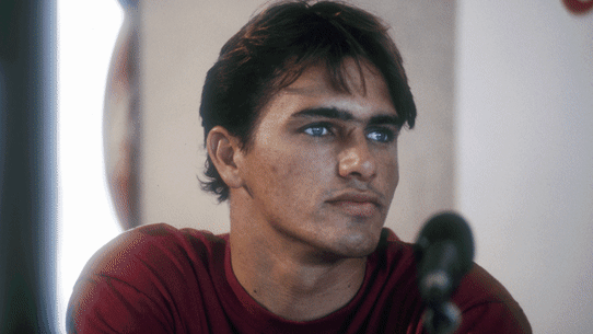 Surfing great Kelly Slater in 1994 and in 2024.