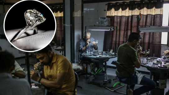 Lab produced diamonds on show at Michael Hill in George Street. 10 March, 2023. Photo: Brook MitchellEmployees inspect and polish diamonds at a B. Virani & Co. workshop in Surat, Gujarat, India, on Tuesday, April 12, 2022. Russia’s invasion of Ukraine is fracturing a billion-dollar trade that spans the permafrost-laden diamond mines of Siberia, secretive trade houses in Antwerp, dusty polishing powerhouses in India and New York’s glittering designer jewelry stores. Photographer: Dhiraj Singh/Bloomberg .
Composite
