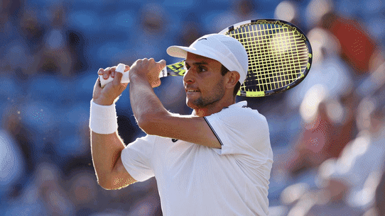 Australian Aleks Vukic (hat) will face defending champion Carlos Alcaraz in the second round at Wimbledon.