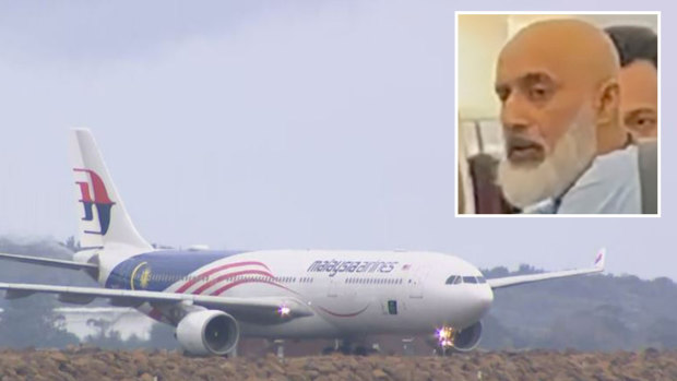 Man charged with making alleged bomb threats on plane refuses to come out of cell