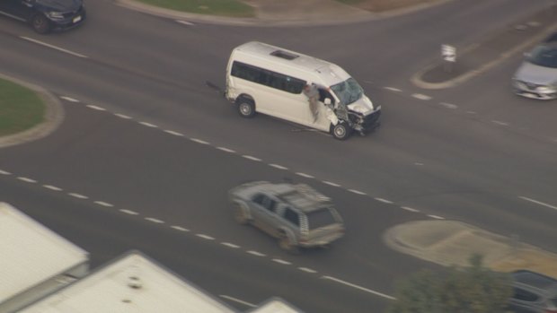 A driver climbs out a van that was pursued by police across Melbourne.