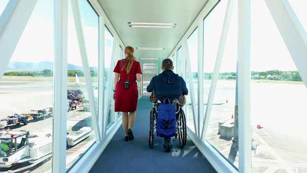 Shane Hryhorec boarding a flight to Japan. Travelling in a wheelchair is totally possible… but the travel industry just needs to get on board.