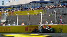 Arvid Lindblad gets out of his car after crashing during practice at the Spanish Grand Prix.