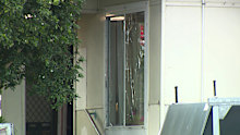 Police say that the woman was shot by another resident of the East Maitland home.
