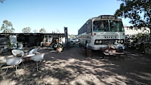 The couple remain trapped living in the bus while their unfinished $700,000 colonial farmhouse sits abandoned.