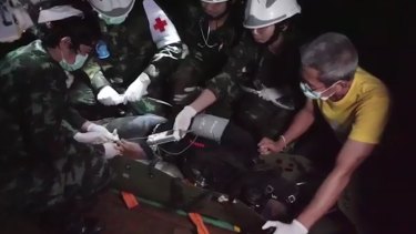 The Tham Luang rescue is captured in a still from a video recorded by Thai Navy SEALs.