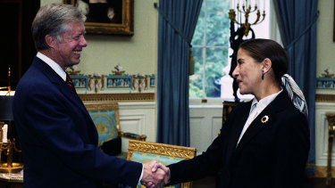Ginsburg and Jimmy Carter shaking hands, c. 1980.