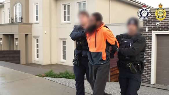 A man who was among four in Melbourne to be charged after allegedly accessing and distributing IS-inspired footage online.