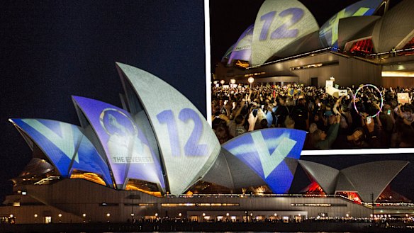 Protesters oppose the projection of material promoting The Everest horse race onto the sails of the Opera House on Tuesday night.