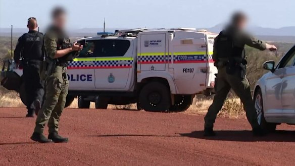 Police, including tactical response group officers, are searching for Kenneth Giles, who is accused of shooting a woman in Mullewa. Picture: 9News Perth 