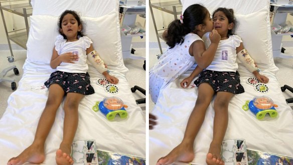 Tharnicaa and her sister Kopika in hospital on Christmas Island on Sunday, June 6.