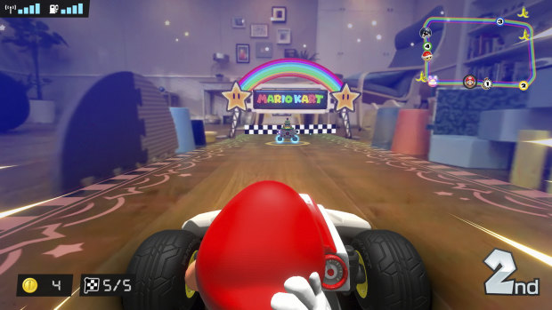 See your home from a different point of view as Mario zooms under your couch and between improvised barriers.